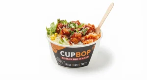 Cupbop bowl with grilled chicken, rice, and kimchi